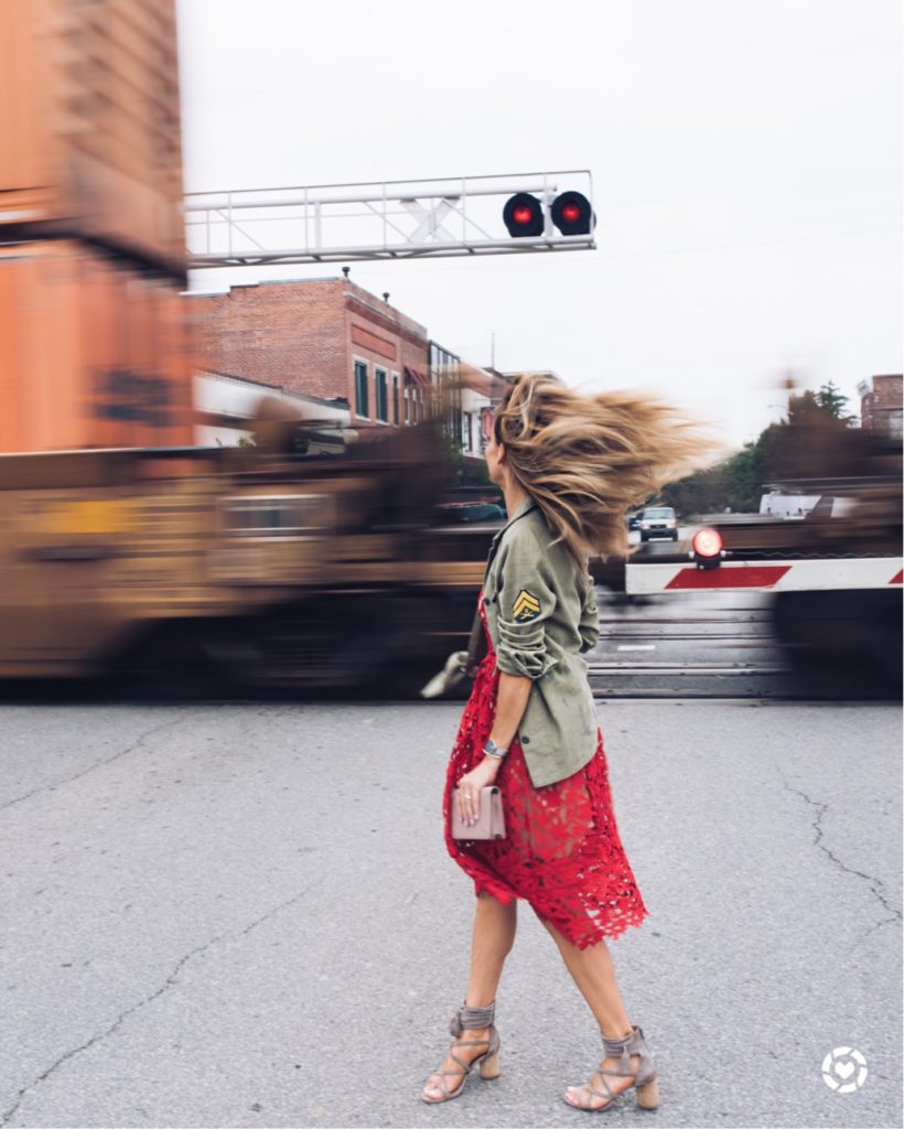 Red lace midi dress and military jacket