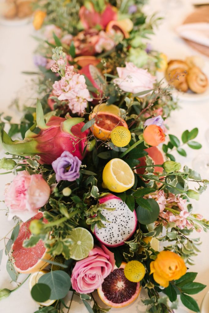 Rusted window floral and fruit arrangement