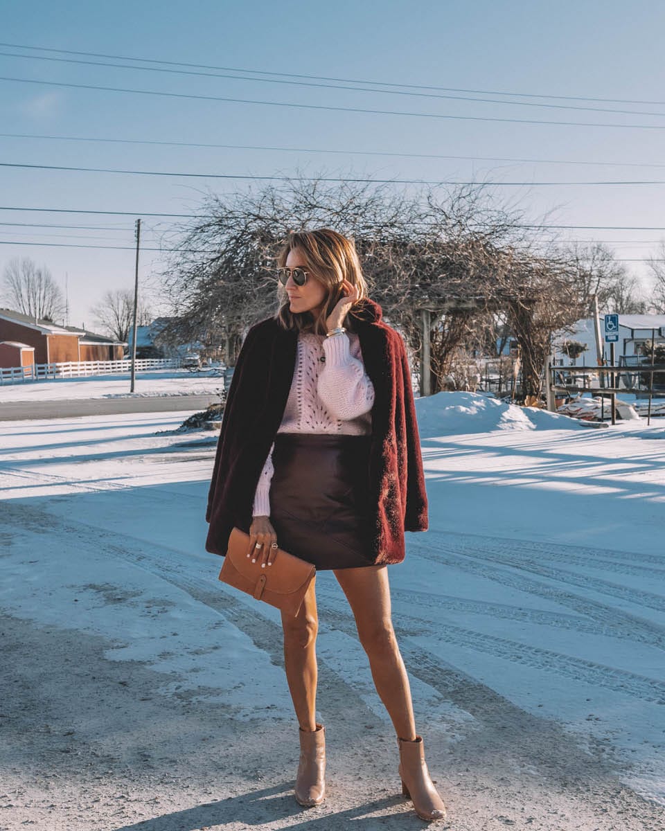 Karina Style Diaries | Pink Sweater | Fur coat | leather skirt | Light pink sweater styled by top Us fashion blogger, Karina Style Diaries: image of a woman wearing an & Other Stories light pink sweater, Goodnight Macaroon mini skirt, a leather clutch, Bernardo booties and ASTR faux fur coat