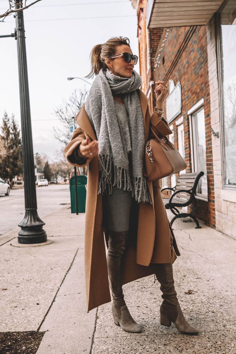 Karina Reske | Camel coat | Grey oversized scarf | Givenchy bag | OTK boots | gucci sunglasses | Zara camel coat styled by top US fashion blogger, Karina Style Diaries: image of a woman wearing an oversized Zara camel coat, H&M grey sweater ,Citizens of Humanity high waisted jeans, Goodnight Macaroons over the knee suede boots, Givenchy anitigona bag and Gucci tortoise shell sunglasses