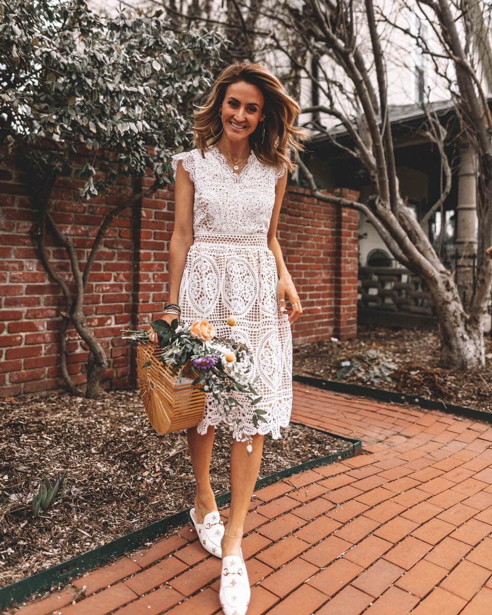 Karina Reske wears a white lace chicwish dress | bamboo bag, flower bouquet | spring white dress | white lace dress | Gucci princetown embroidered loafers