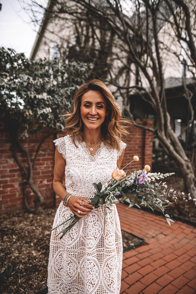 Karina Reske wears a white lace chicwish dress | bamboo bag, flower bouquet | spring white dress | white lace dress | Gucci princetown embroidered loafers