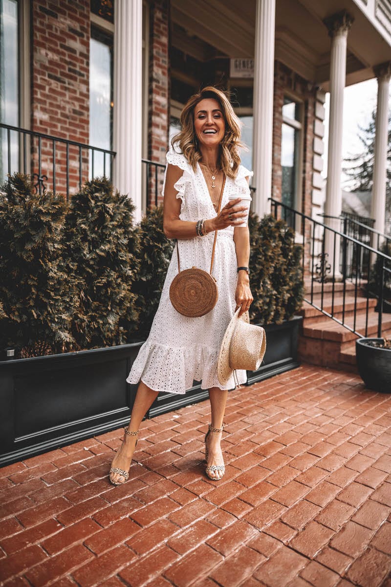 Fashion Blogger Katrina Reske | white eyelet dress | ruffle eyelet dress | deep neck | ruffle hem and sleeves | Straw hat | circle basquet bag | leopard printed heels | layered necklace