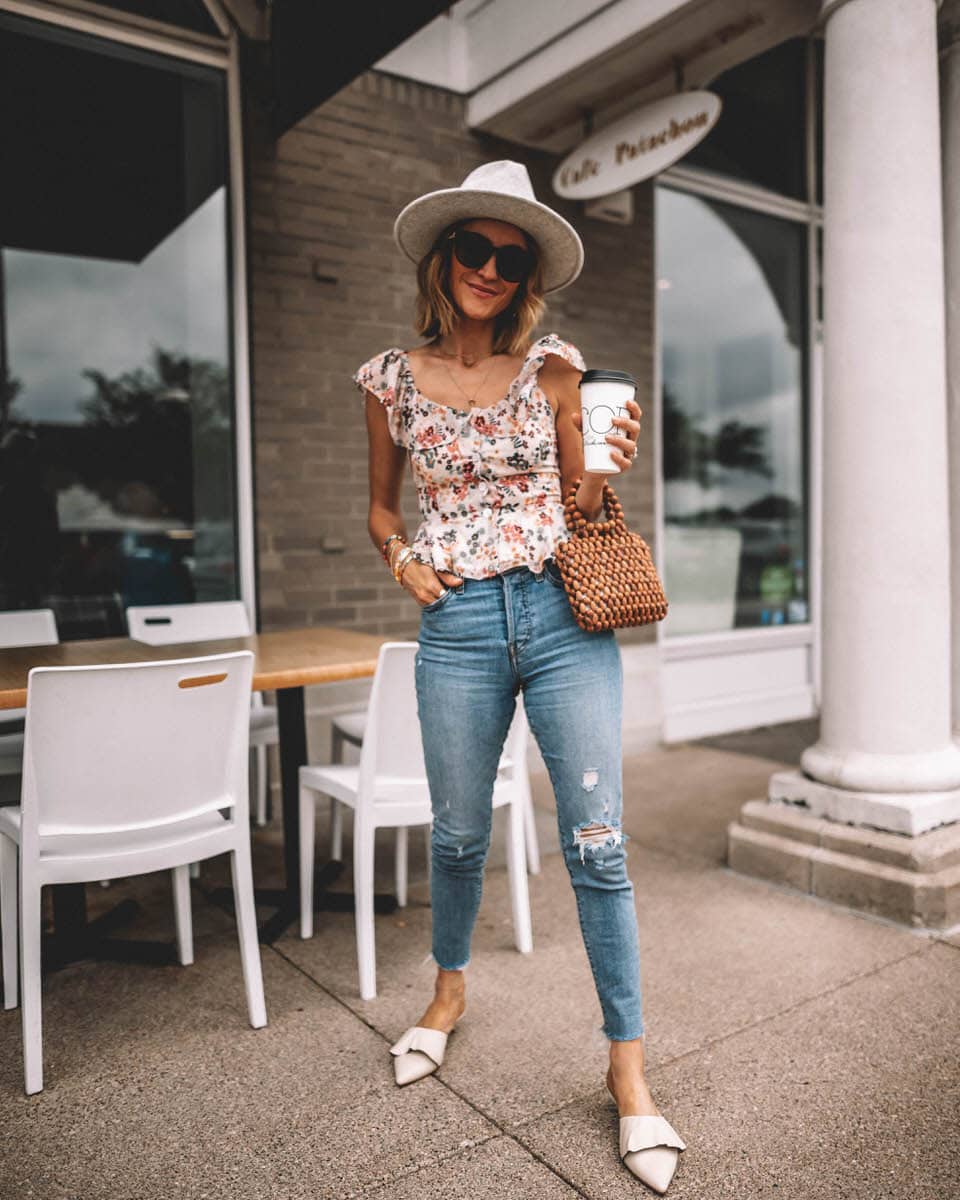 Fashion Blogger Karina Reske wearing Tularosa Label floral top | levi's wedgie high waited denim | lack of colors grey hat 