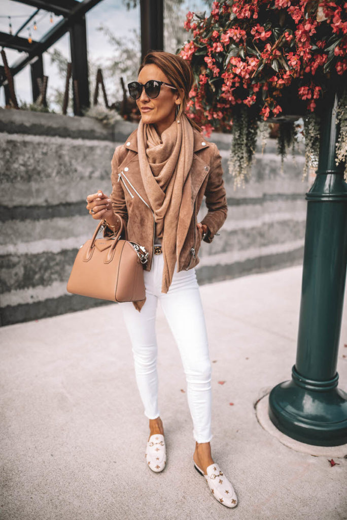 Karina Style Diaries wearing white jeans chic outfit suede moto jacket cashmere scarf gucci princetown bumblebee loafer givenchy antigona gucci belt  