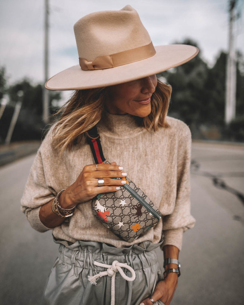 Karina Style Diaires wearing fine-knit beige oatmeal sweater high waist paper bag foil shorts over the knee suede boots gucci belt bag lack of colors ivory rancher hat