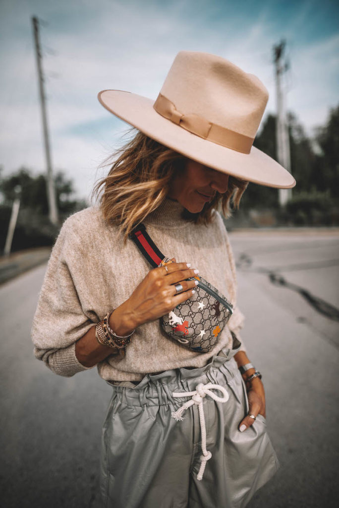 Karina Style Diaires wearing fine-knit beige oatmeal sweater high waist paper bag foil shorts over the knee suede boots gucci belt bag lack of colors ivory rancher hat