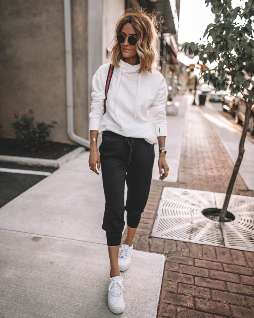 Karina Style Diaries wearing white cowl neck sport pullover black joggers white snekakers casual black & white outfit