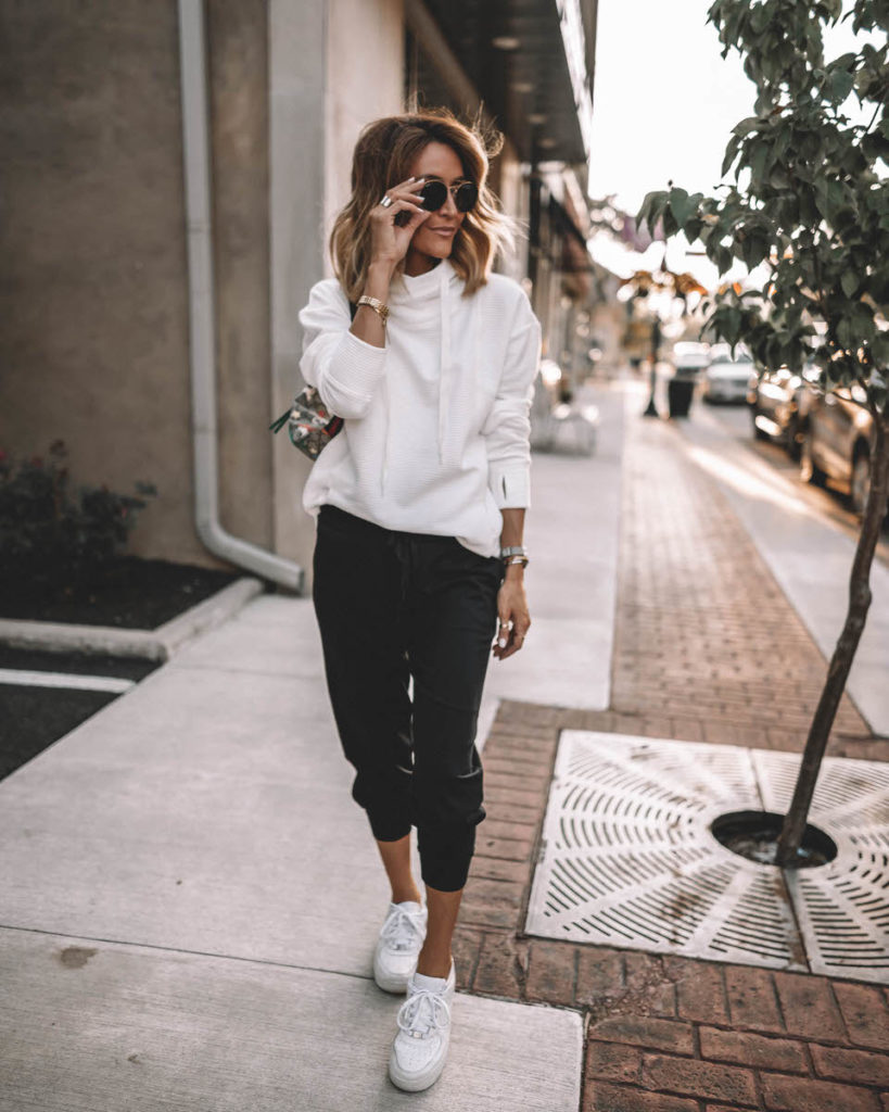 Karina Style Diaries wearing white cowl neck sport pullover black joggers white snekakers casual black & white outfit