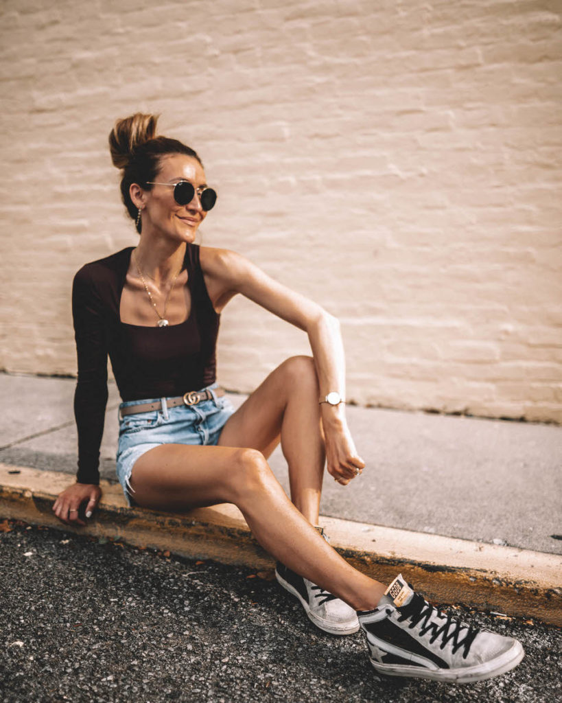 Karina Style Diaries wearing GRLFRN denim shorts Gucci belt Superdown  long sleeve top Golden Goose hi-tops sporty outfit