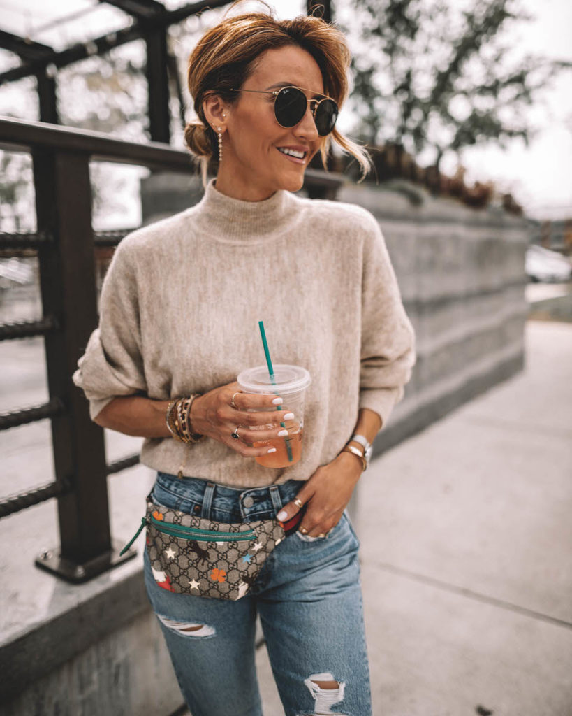 Karina Style Diaries wearing a cream sweater levis 501 gucci belt bag gucci princetown