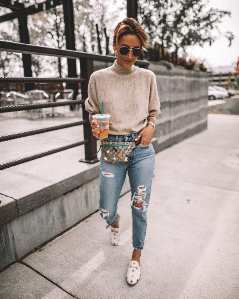 Karina Style Diaries wearing a cream sweater levis 501 gucci belt bag gucci princetown