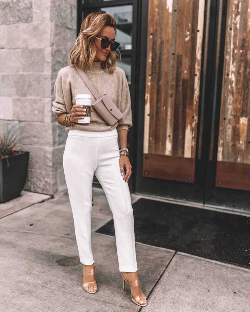 Karina Reske wearing fine-knit sweater white career pants clear heels nude belt bag work outfit