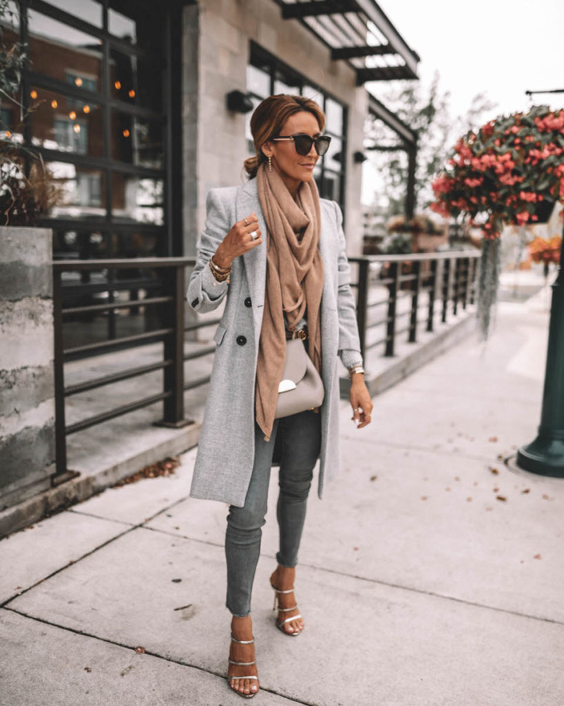 Karina Style Diaries wearing structured grey coat camel cashmere scarf grey skinny jeans gucci belt Polene Numero Un mini grey silver strappy sandals