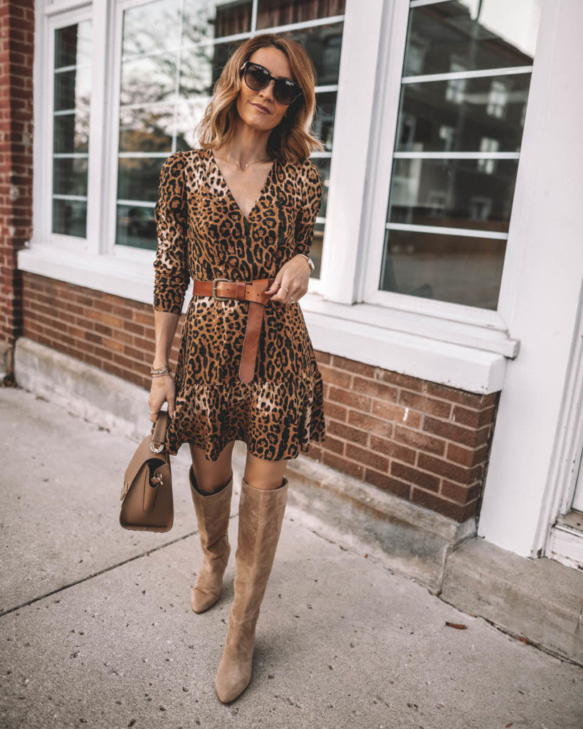 Karina Style Diaries wearing leopard print mini dress belted tall suede boots Zac Posen top handle Eartha handbag