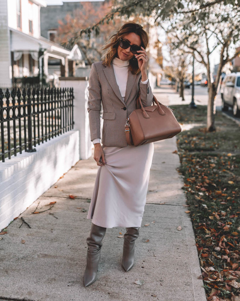 Karina Style Diaries wearing silk skirt knee high boots plaid blazer turtleneck top Givenchy Antigona Small