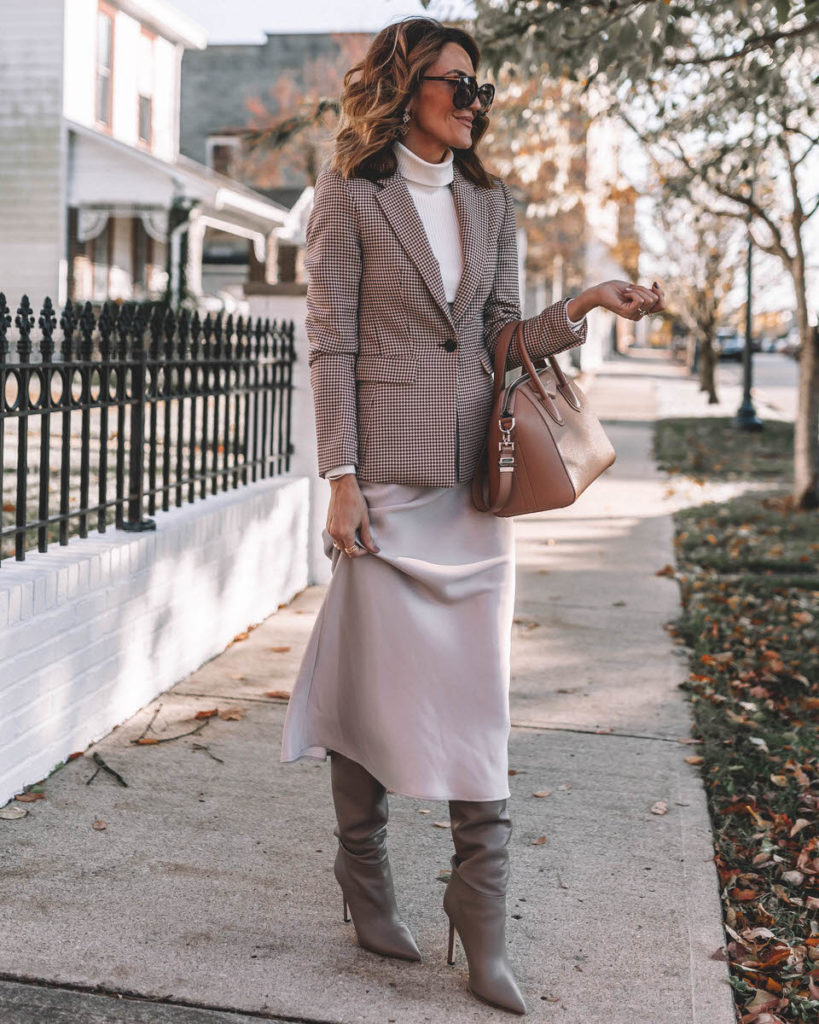 Karina Style Diaries wearing silk skirt knee high boots plaid blazer turtleneck top Givenchy Antigona Small