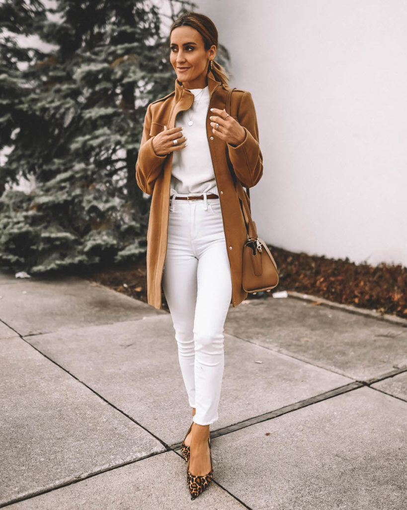 Style Blogger Karina Reske wearing camel coat winter white jeans white sweater