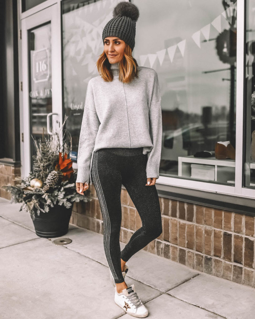 Karina Style Diaries wearing sparkly black and silver leggings grey sweater pompom beanie