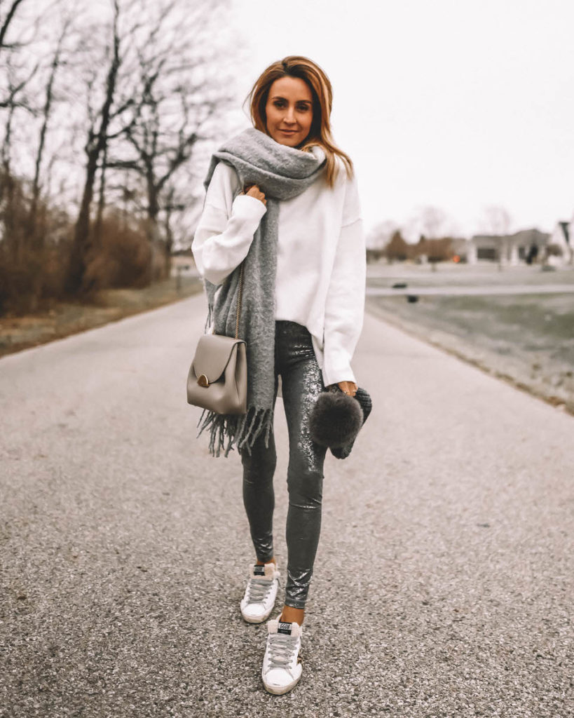 Karina Style Diaries wearing foil silver leggings oversized white sweater oversized blanket scarf Golden Goose sherpa sneakers