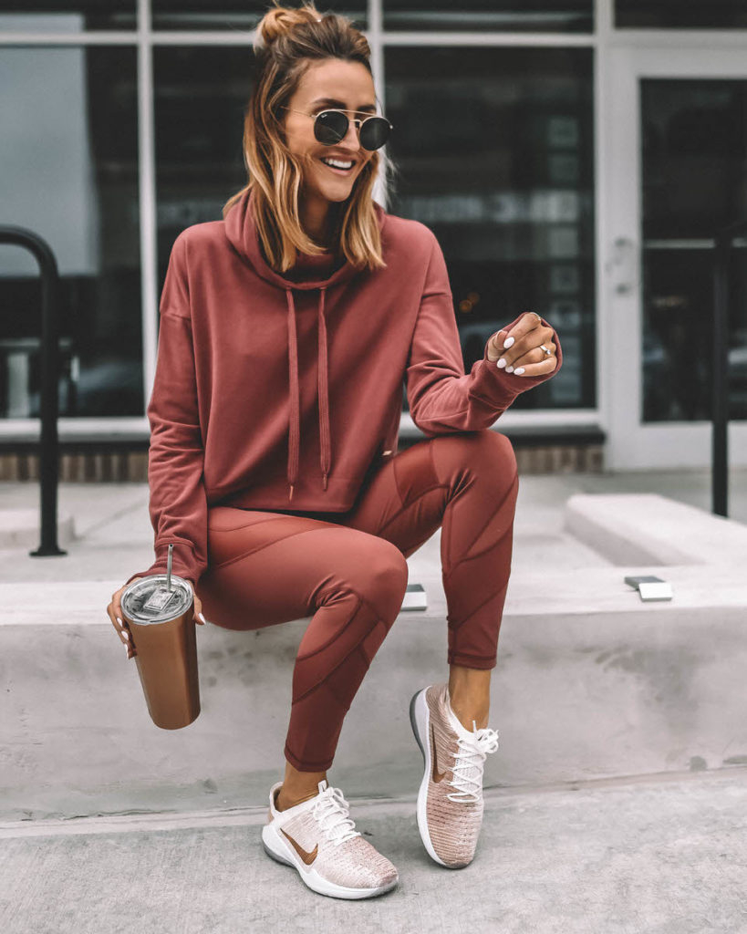 Lifestyle Blogger Karina Reske wearing Athletic set Sweaty Betty rust leggings and hoodie