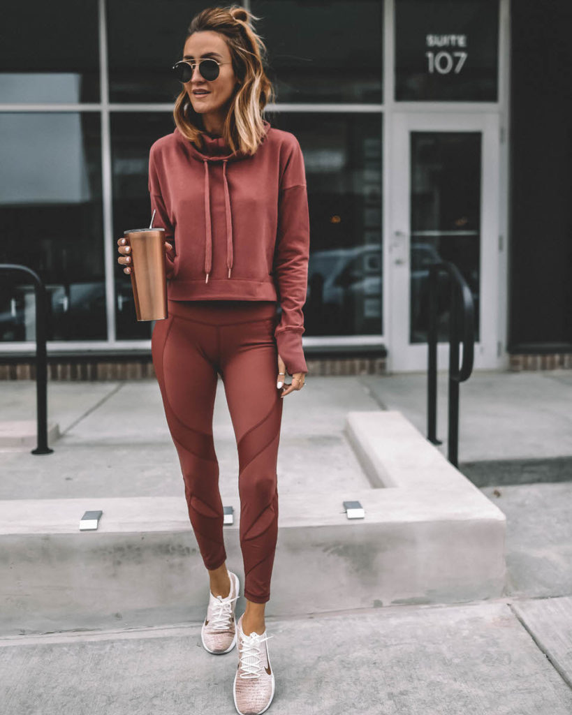 Lifestyle Blogger Karina Reske wearing Athletic set Sweaty Betty rust leggings and hoodie