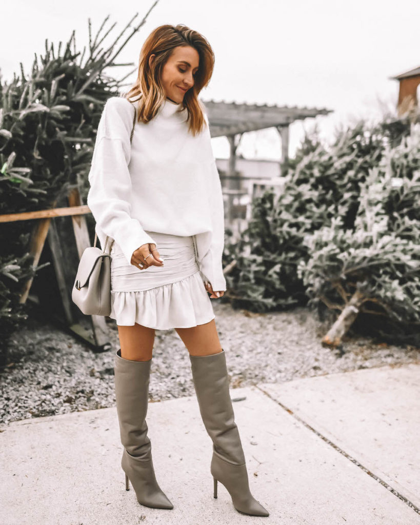 white sweater white mini skirt tall slouchy grey boots Holiday Style