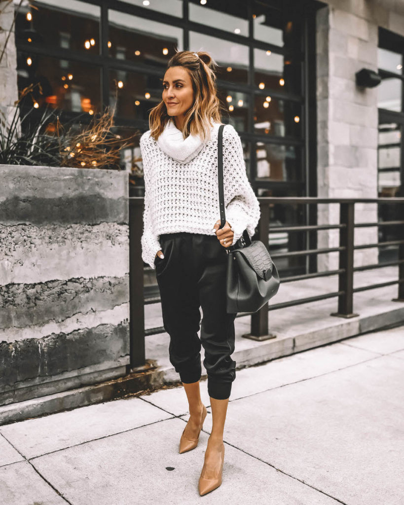 Karina Style Diaries wearing white cowl neck sweater black satin joggers nude pumps holiday outfit