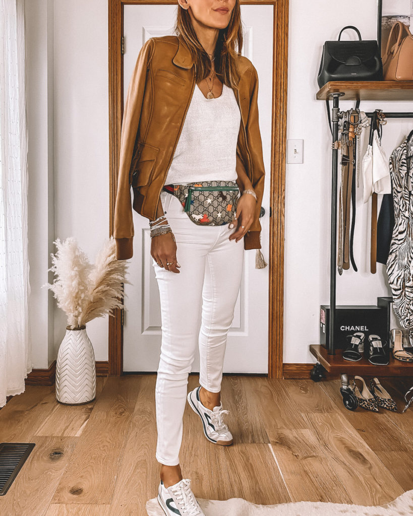 High waisted skinny cropped white jeans Gucci belt bag camel bomber jacket casual street style