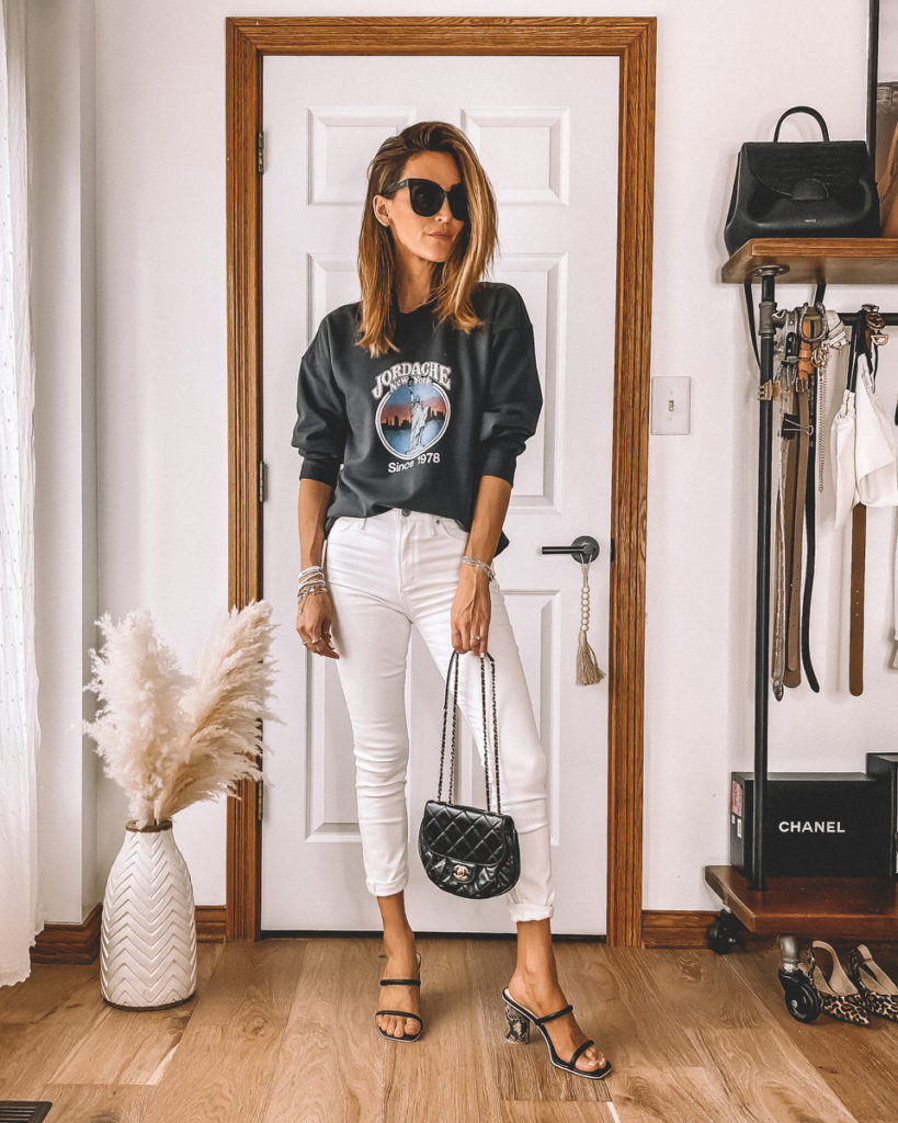 Vintage sweatshirt high waited white jeans black strappy heels casual style