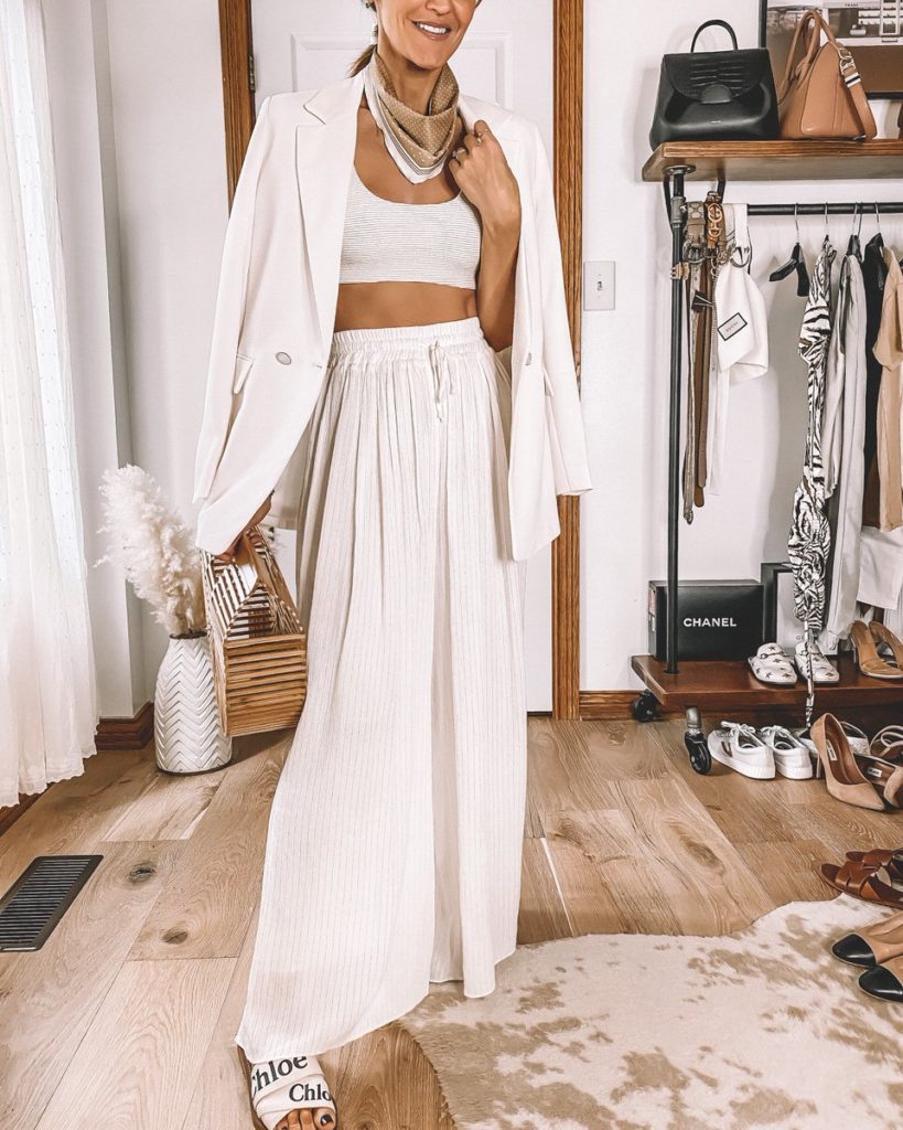 Karina Style Diaries wearing all white outfit white flowy pants white bikini top white long blazer