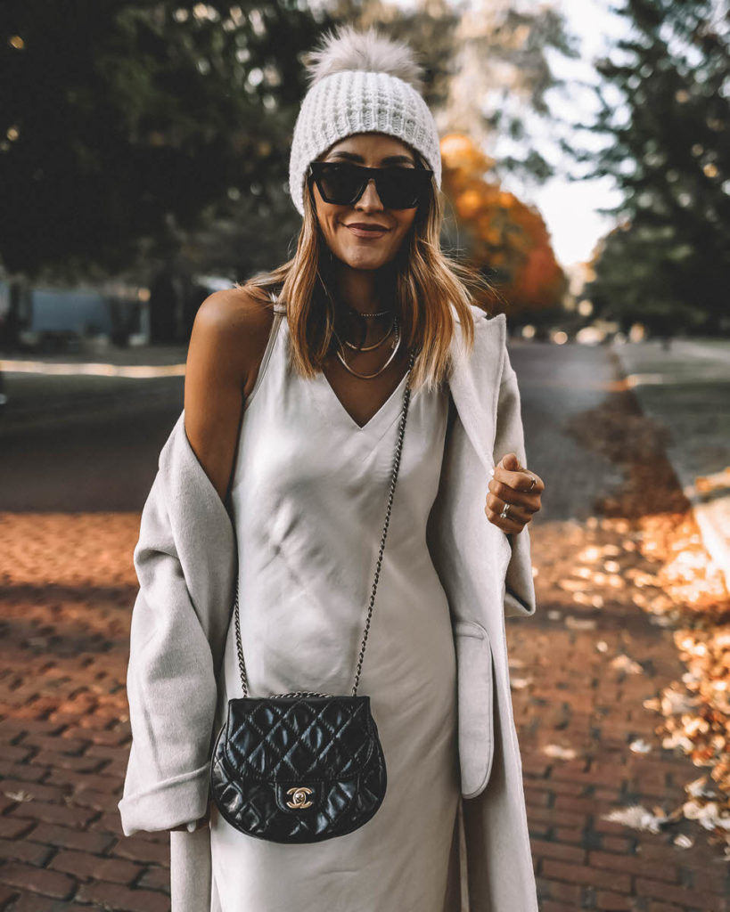 Satin slip dress outfit oversized cardigan white beanie chanel bag neutral style