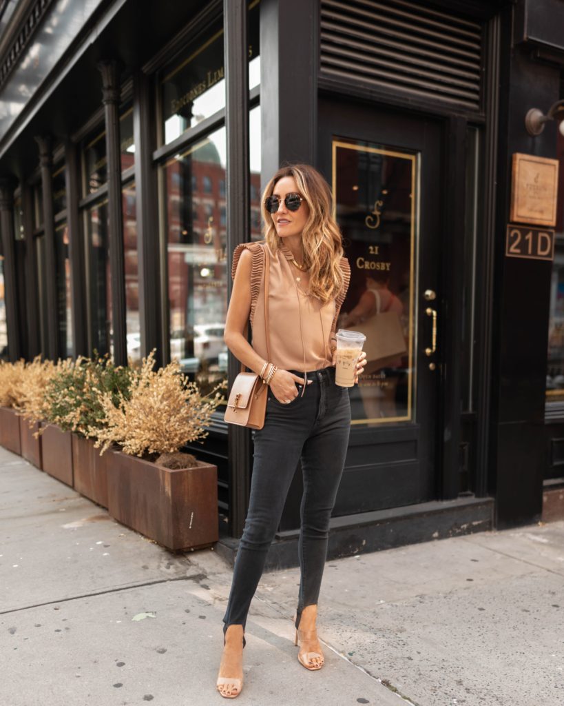 Karina Style Diaries wearing express jeans, pleated mock neck top, heels, electric pick jewelry