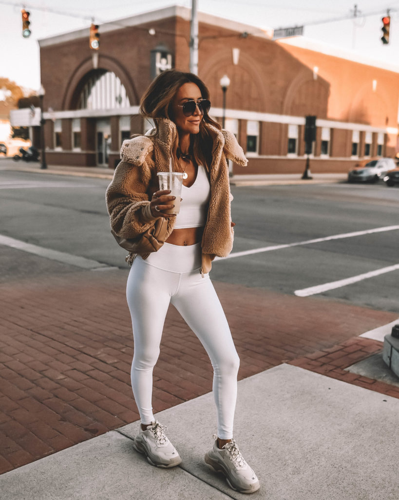 karina style diaries wearing alo yoga sherpa, white top, white leggings, balenciaga sneakers