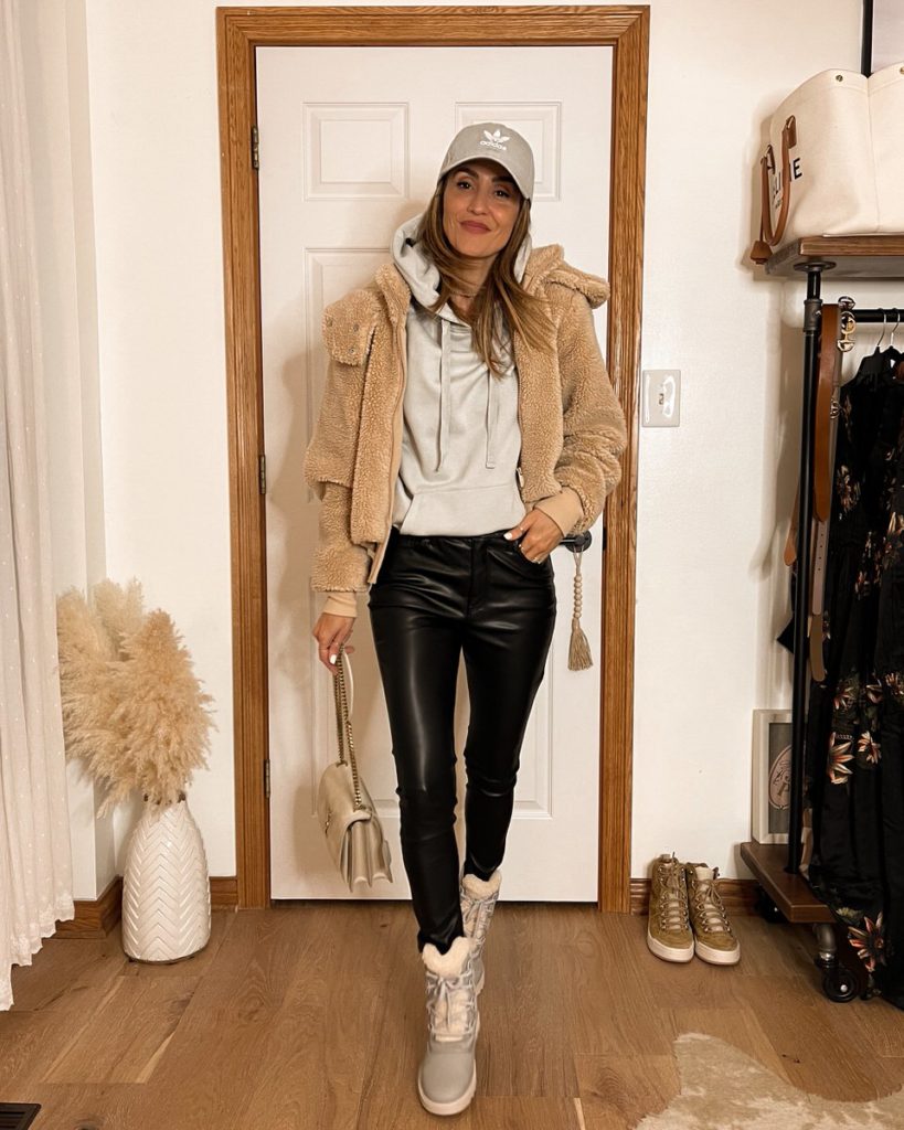 Karina wears alo yoga sherpa jacket and walmart faux fur leggings