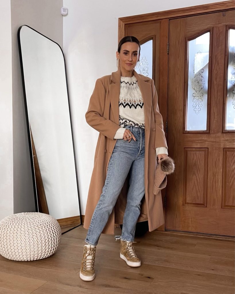 Karina wears evereve pullover sweater and camel coat cozy holidau outfit