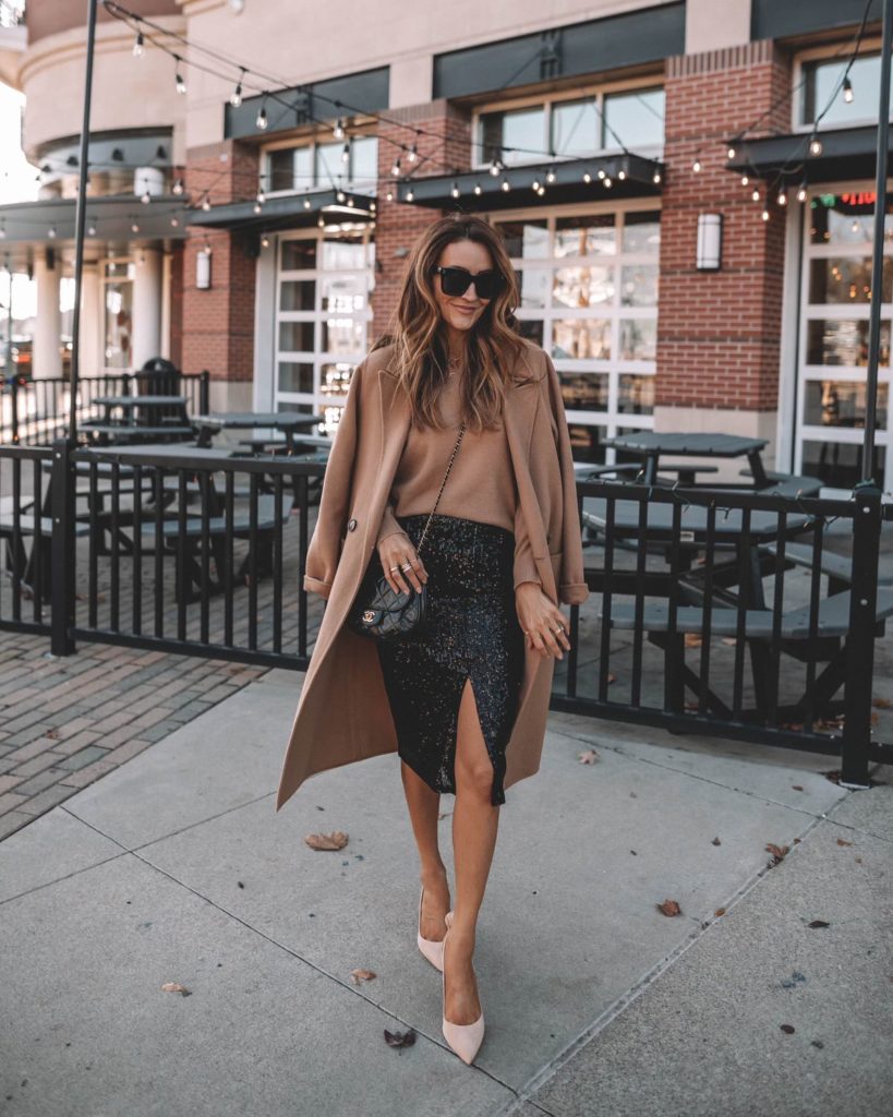 Karina wears nordstrom sequin skirt with camel coat