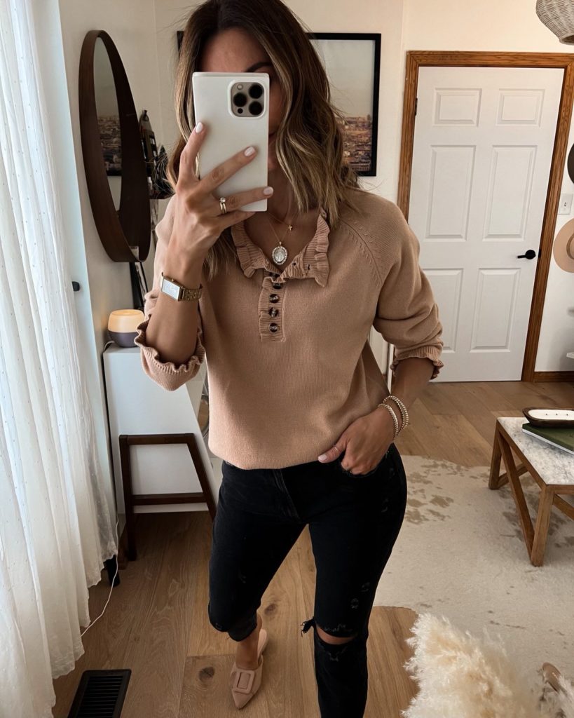 Karina wears amazon tan ruffle neckline sweater with abercrombie jeans