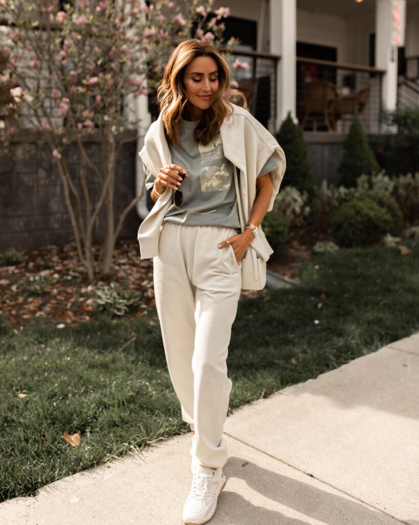 Karina wears Calvin Klein matching white sweatpant and sweatshirt with green graphic tee