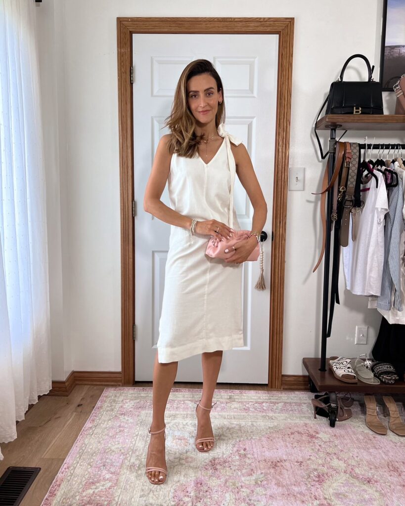 Karina wears Walmart linen dress with tie shoulder