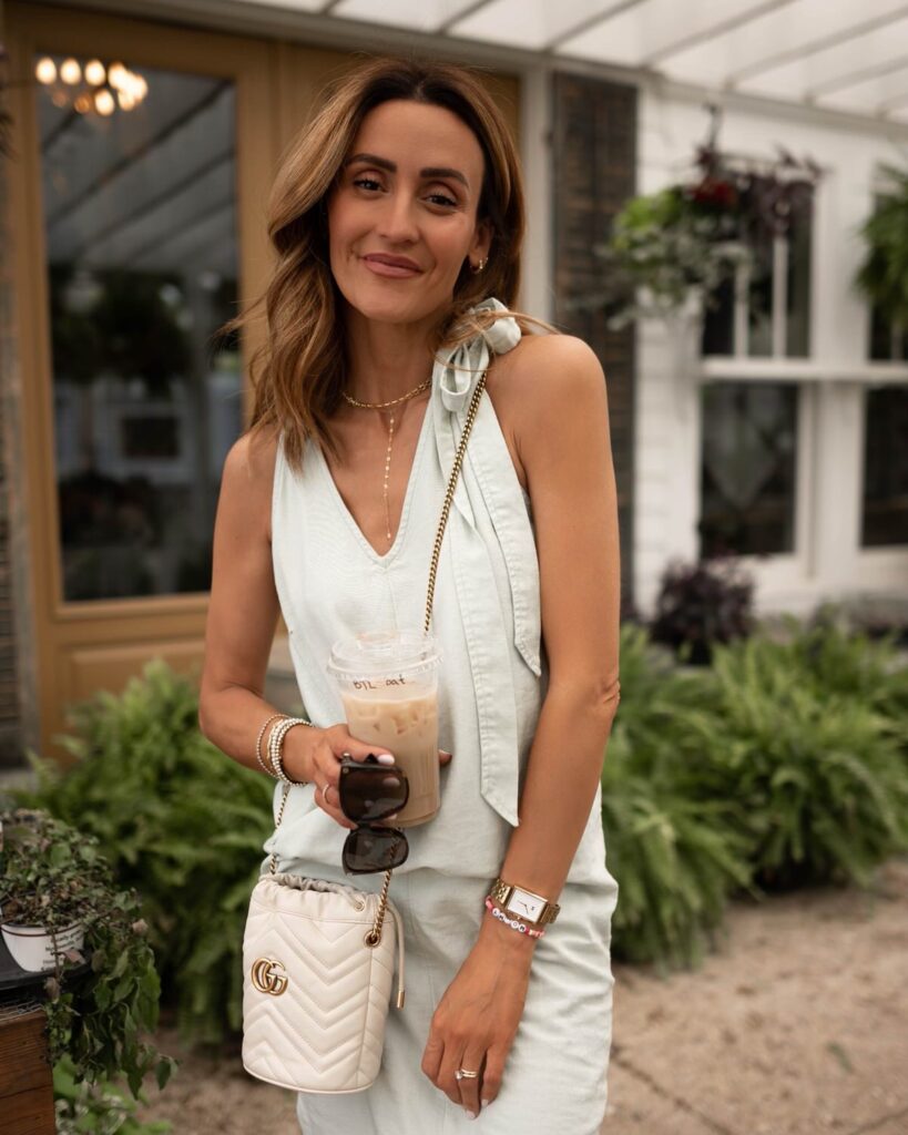 Karina wears Walmart linen dress with tie shoulder