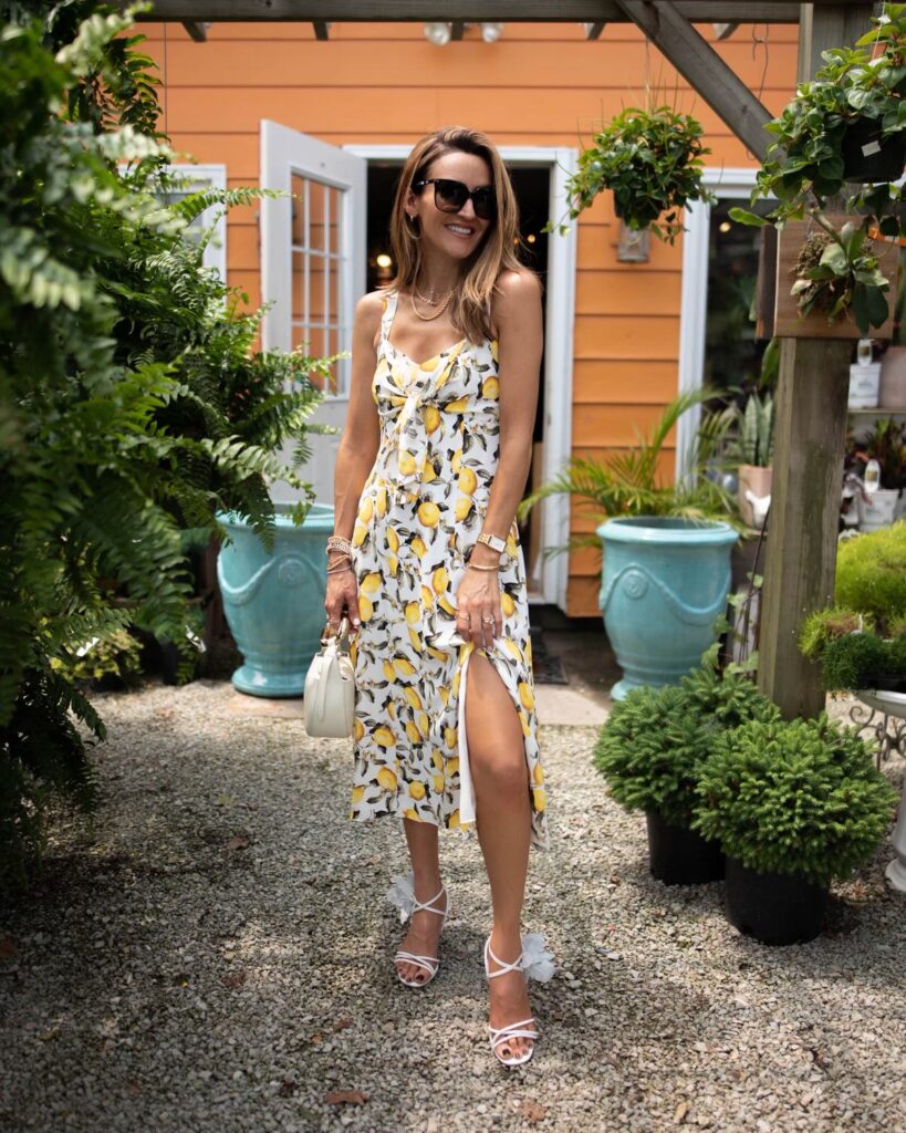 karina wears white house black market lemon print midi dress with chloe kiss bag