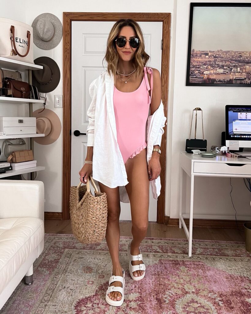 Karina wears gucci dad sandal with pink one piece swimsuit and linen cover up