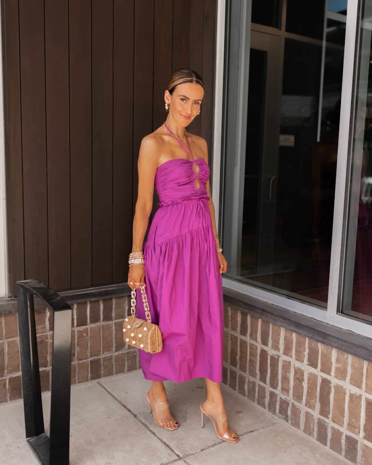 karina wears pink ulla johnson midi dress with wicker bag