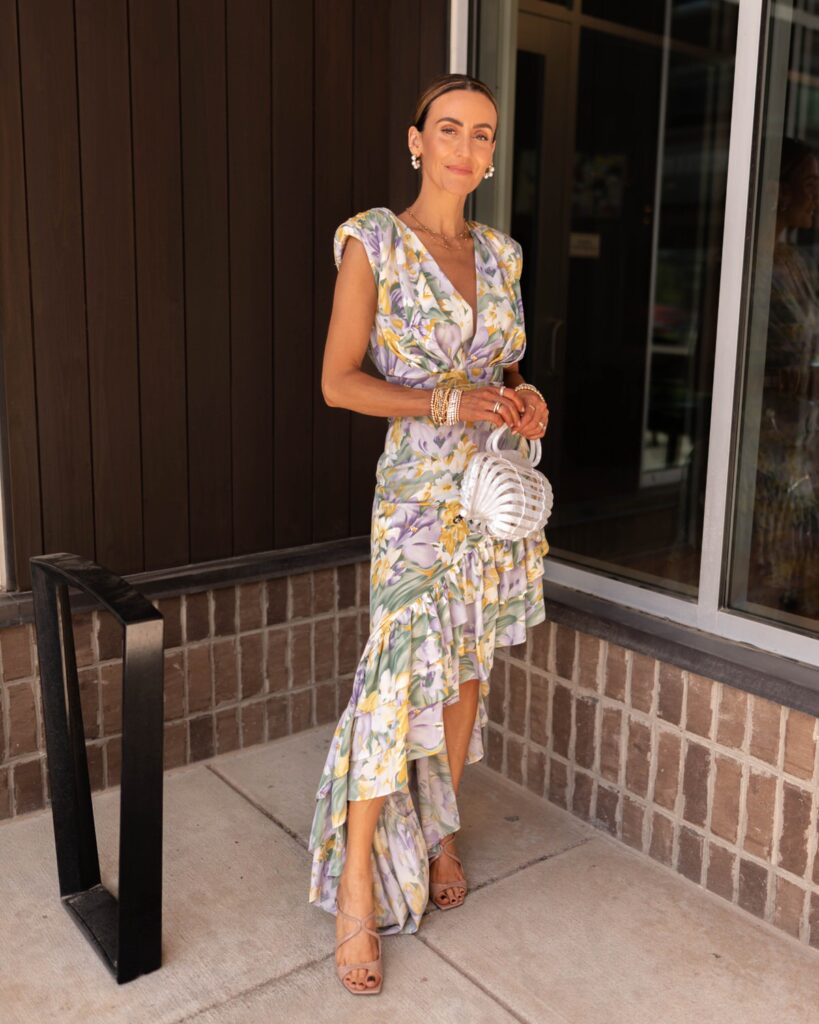 karina wears bronx and banco floral asymmetrical ruffle maxi dress