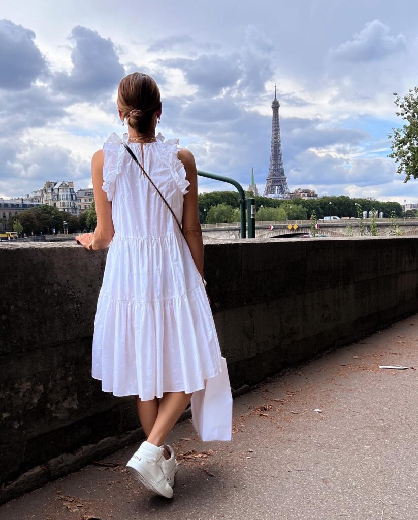 what to wear while walking around Paris - ruffled white mini dress with white sneakers