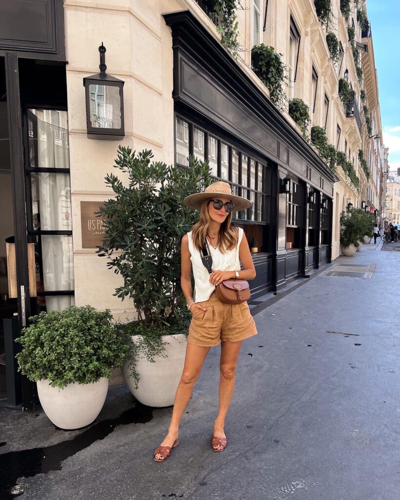 what to wear while walking around Paris - linen shorts and a sweater tank with sandals