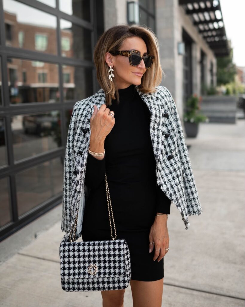 karina wears WHBM black dress with houndstooth blazer and handbag