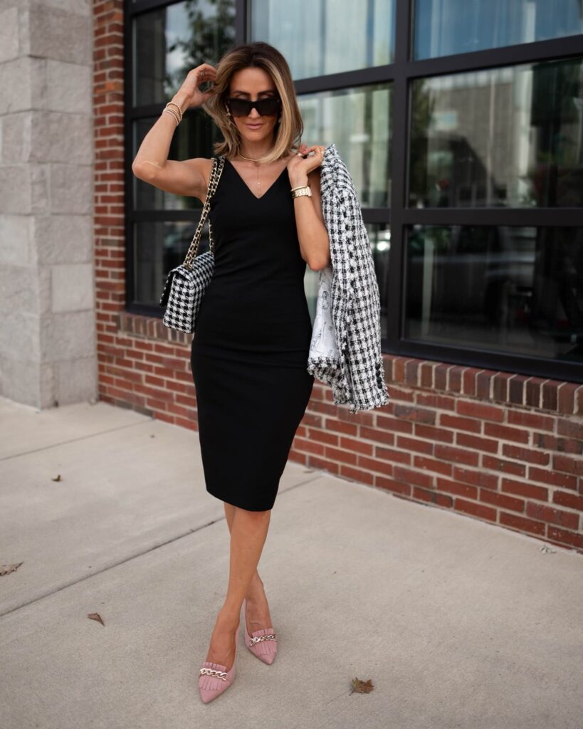 karina wears WHBM black dress with houndstooth blazer and handbag