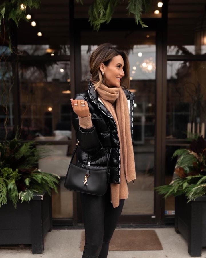 Karina wears black puffer moncler jacket and ysl handbag